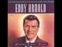 Il testo della He lives next door Eddy Arnold