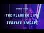 Il testo della Turning violent Flaming Lips