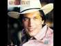 Il testo della Every time it rains (lord don't it pour) George Strait