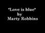 Il testo della Love is blue Marty Robbins