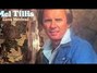 Il testo della Walking on new grass Mel Tillis
